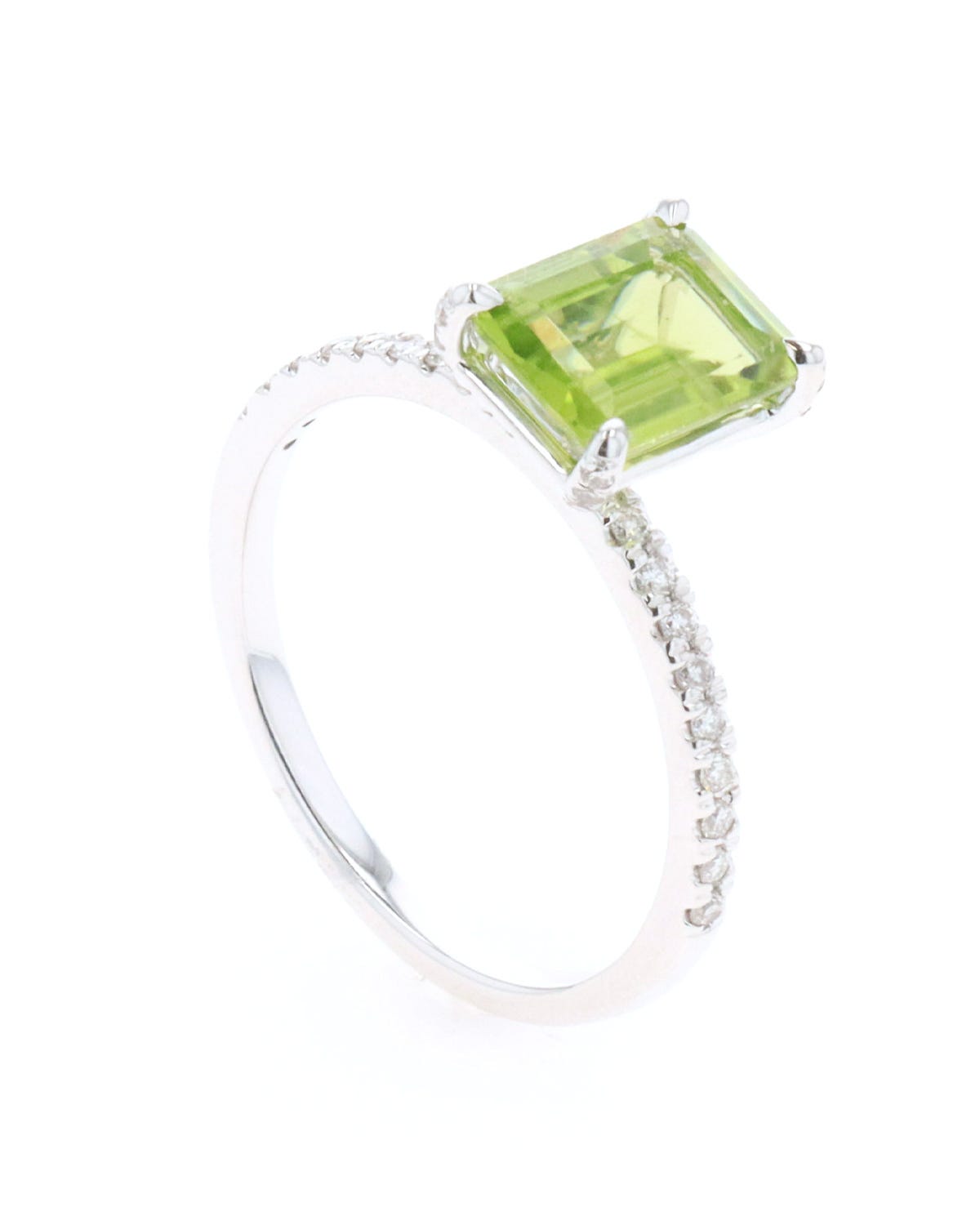 Anillo de oro blanco 14k con 25 pts de diamante y peridot