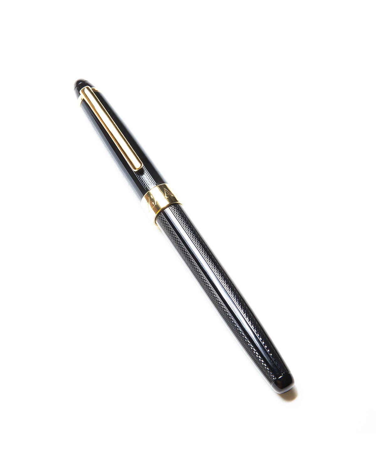 pluma bizzarro negra con dorado tinta azul