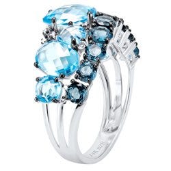 Anillo de oro blanco con topacio